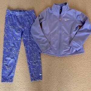 Two piece Nike purple athletic suit. Leggings and zip up jacket with pockets. Y6